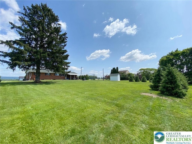3111 Pheasant Dr, Moore Twp, PA 18067 - view of grassy yard featuring a shed