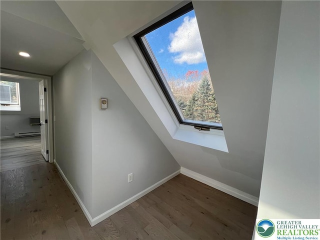 106 Lynx Ln, Chestnuthill Twp, PA 18330 - additional living space with wood finished floors, baseboard heating, a skylight, and recessed lighting