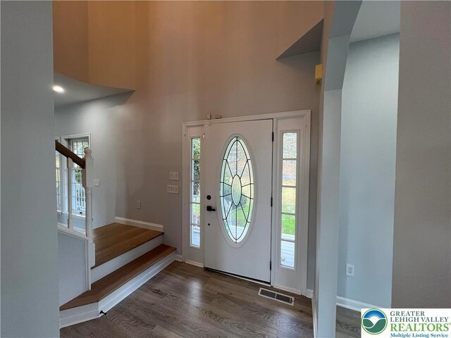 106 Lynx Ln, Chestnuthill Twp, PA 18330 - entryway featuring wood finished floors, healthy amount of natural light, stairs, and a towering ceiling
