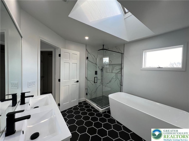 106 Lynx Ln, Chestnuthill Twp, PA 18330 - full bath featuring a marble finish shower, a freestanding tub, double vanity, tile patterned floors, and recessed lighting