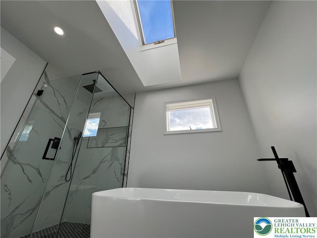 106 Lynx Ln, Chestnuthill Twp, PA 18330 - bathroom featuring a freestanding tub, a marble finish shower, and recessed lighting