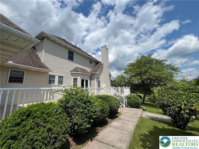 106 Lynx Ln, Chestnuthill Twp, PA 18330 - view of property exterior with a chimney and roof with shingles