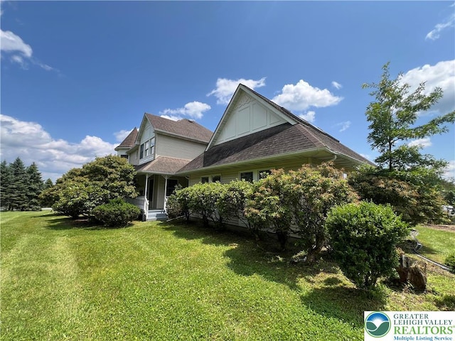 106 Lynx Ln, Chestnuthill Twp, PA 18330 - view of home's exterior featuring a lawn and board and batten siding