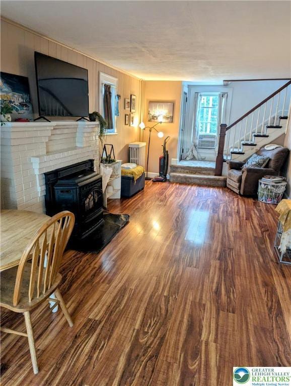 2816 W Columbia St, South Whitehall Twp, PA 18104 - living room featuring stairway, wood finished floors, and a wood stove