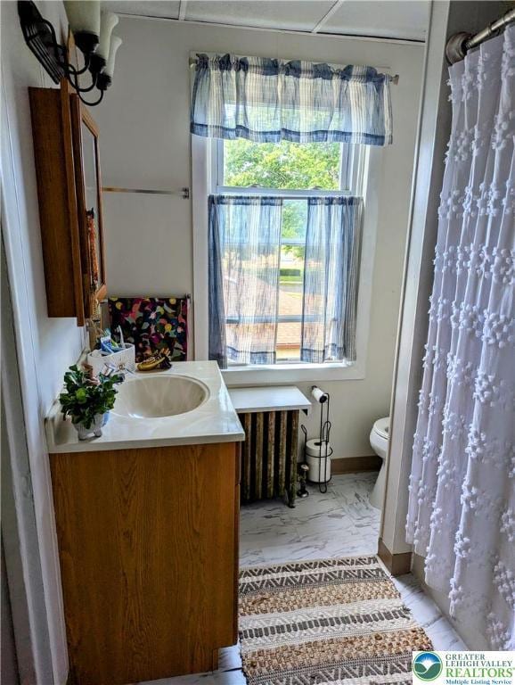 2816 W Columbia St, South Whitehall Twp, PA 18104 - bathroom featuring vanity, marble finish floors, a shower with curtain, and radiator