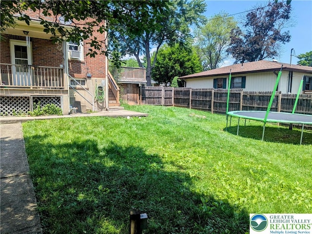 2816 W Columbia St, South Whitehall Twp, PA 18104 - fenced backyard featuring a trampoline, stairs, and cooling unit