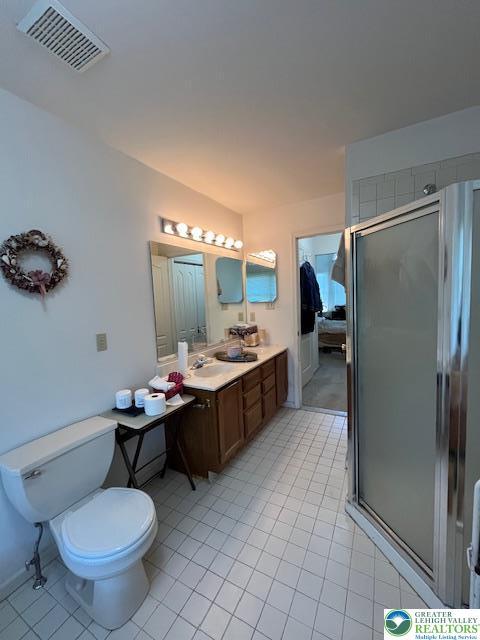 255 Ridings Cir, Macungie Boro, PA 18062 - bathroom featuring a shower stall, vanity, and tile patterned flooring