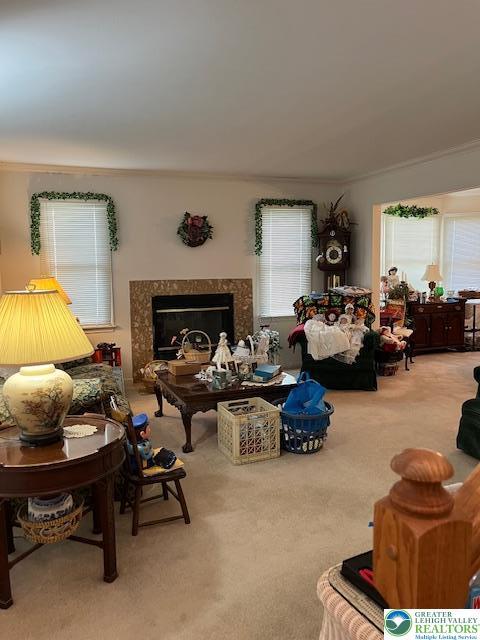 255 Ridings Cir, Macungie Boro, PA 18062 - living room featuring a high end fireplace, crown molding, and carpet floors