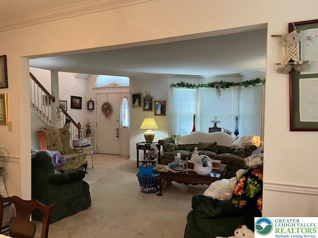 255 Ridings Cir, Macungie Boro, PA 18062 - carpeted living area featuring crown molding and stairs