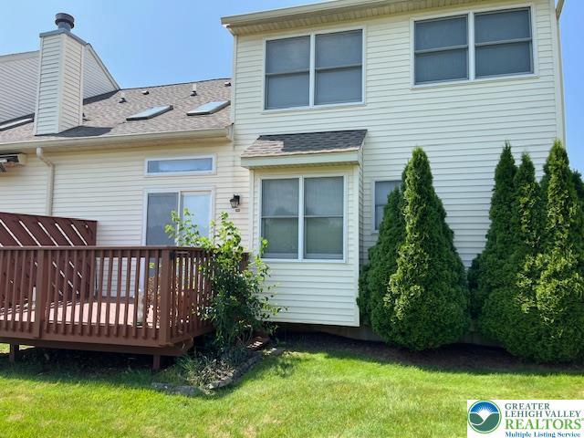 255 Ridings Cir, Macungie Boro, PA 18062 - rear view of house featuring a deck, a yard, and a shingled roof