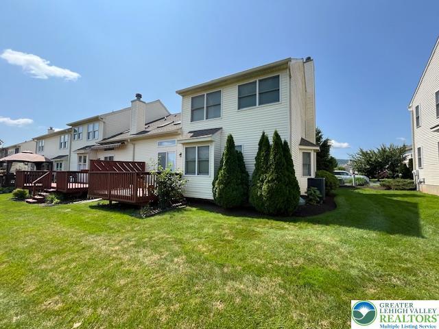 255 Ridings Cir, Macungie Boro, PA 18062 - back of property with a deck, a lawn, and a residential view