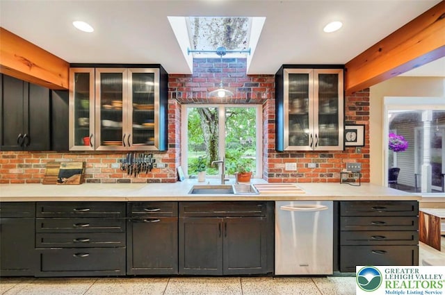 938 Meadow Cir, Bethlehem City, PA 18017 - kitchen with dark speckled floor, light countertops, a skylight, glass insert cabinets, and recessed lighting