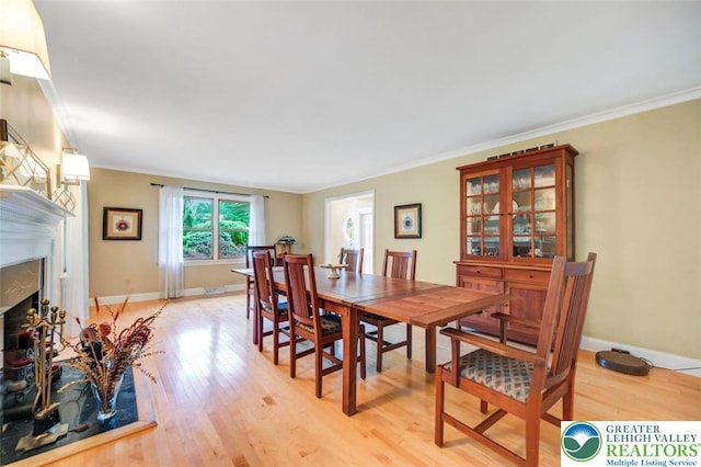 938 Meadow Cir, Bethlehem City, PA 18017 - dining room featuring light wood-style floors, ornamental molding, and a high end fireplace