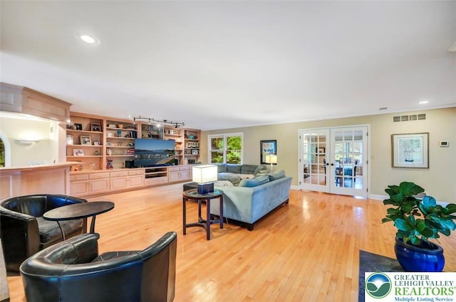 938 Meadow Cir, Bethlehem City, PA 18017 - living room featuring french doors, light wood-type flooring, and recessed lighting