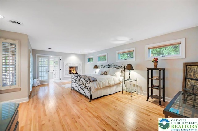 938 Meadow Cir, Bethlehem City, PA 18017 - bedroom featuring light wood-style floors and a premium fireplace