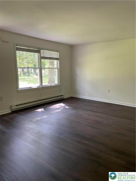 849 Weir Lake Rd, Chestnuthill Twp, PA 18058 - empty room featuring baseboard heating and dark wood-type flooring