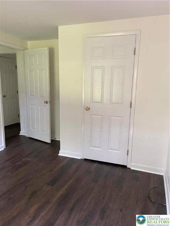 849 Weir Lake Rd, Chestnuthill Twp, PA 18058 - unfurnished bedroom featuring dark wood finished floors