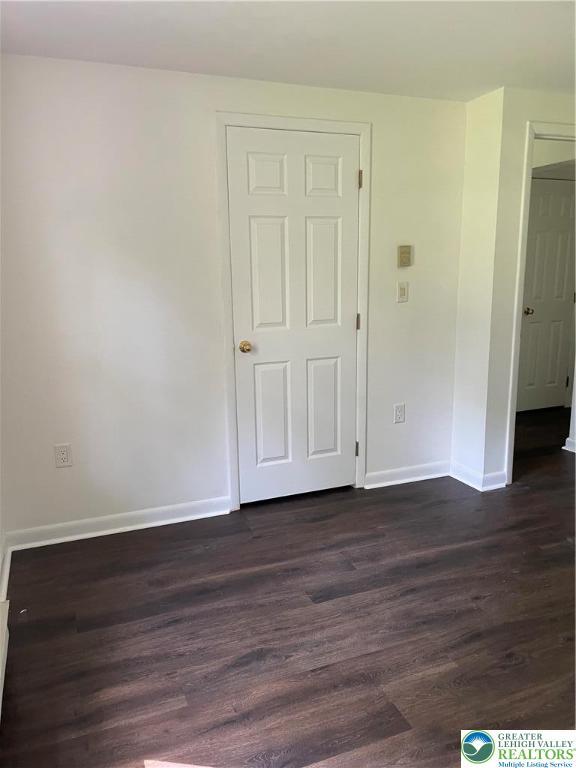 849 Weir Lake Rd, Chestnuthill Twp, PA 18058 - empty room featuring dark wood-style floors and baseboards