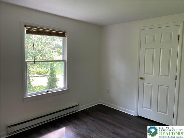 849 Weir Lake Rd, Chestnuthill Twp, PA 18058 - spare room featuring baseboard heating and dark wood-style floors