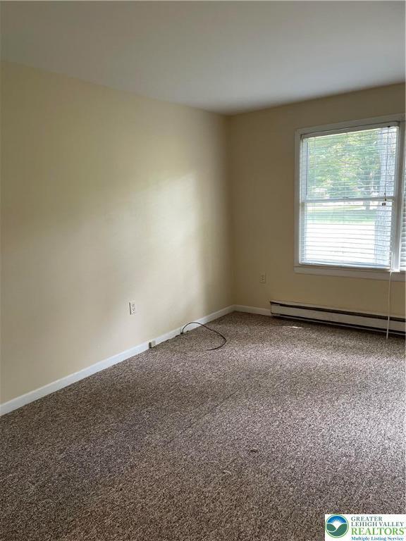 849 Weir Lake Rd, Chestnuthill Twp, PA 18058 - unfurnished room with baseboard heating and carpet floors