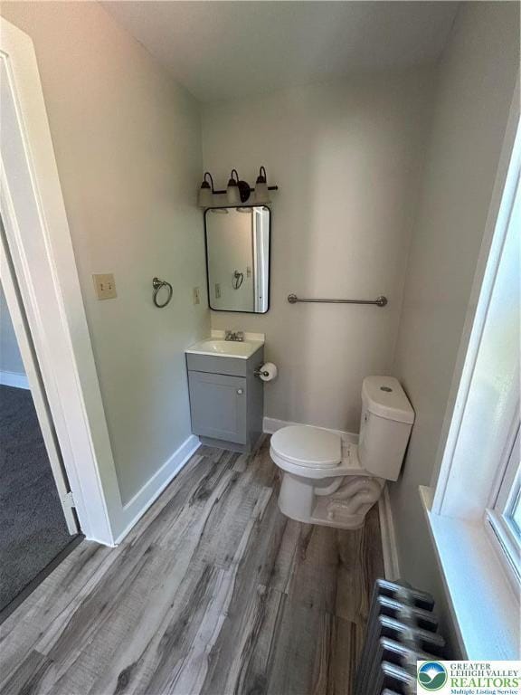 230 White St, Lehighton Boro, PA 18235 - half bath featuring wood finished floors, radiator, and vanity