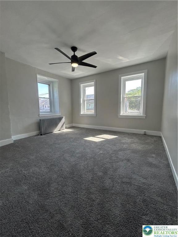 230 White St, Lehighton Boro, PA 18235 - unfurnished room with radiator, carpet floors, and ceiling fan