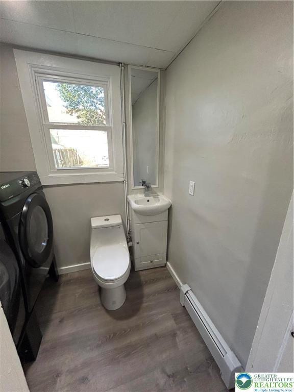 230 White St, Lehighton Boro, PA 18235 - bathroom with baseboard heating, wood finished floors, vanity, and washer / dryer