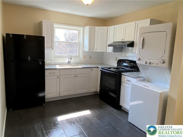 1295 Bunny Ln, Chestnuthill Twp, PA 18322 - kitchen featuring black appliances, stacked washer and clothes dryer, under cabinet range hood, and white cabinets