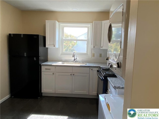1295 Bunny Ln, Chestnuthill Twp, PA 18322 - kitchen with black appliances, white cabinets, and light stone counters