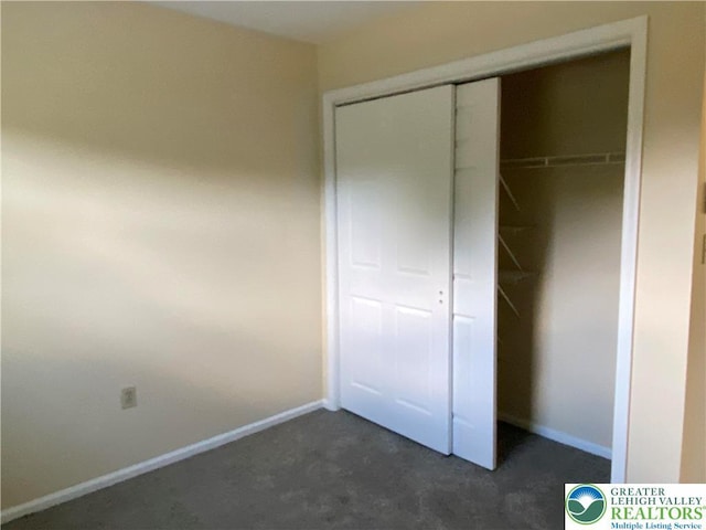 1295 Bunny Ln, Chestnuthill Twp, PA 18322 - unfurnished bedroom featuring dark carpet and a closet