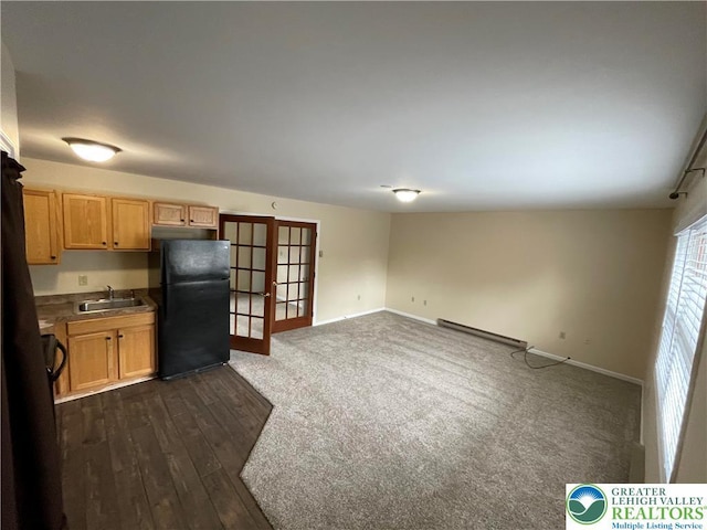 1295 Bunny Ln, Chestnuthill Twp, PA 18322 - kitchen featuring freestanding refrigerator, french doors, baseboard heating, and dark wood-type flooring