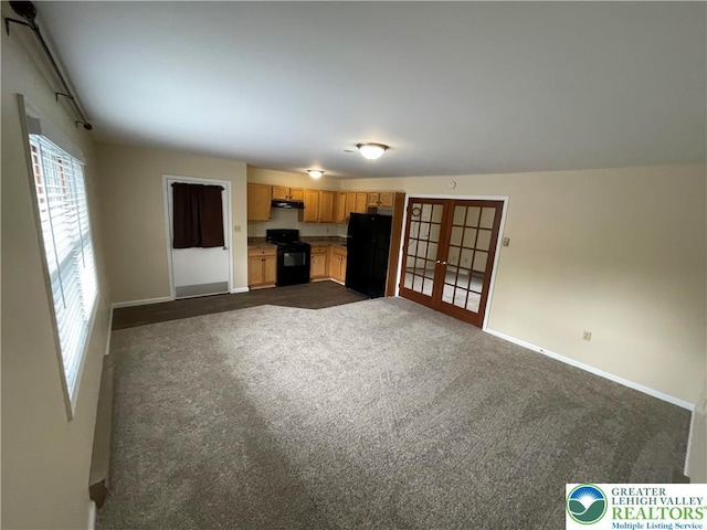 1295 Bunny Ln, Chestnuthill Twp, PA 18322 - unfurnished living room with french doors and dark carpet