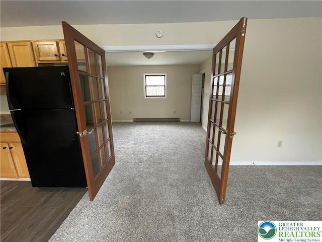 1295 Bunny Ln, Chestnuthill Twp, PA 18322 - spare room with french doors, a baseboard heating unit, dark colored carpet, and a smoke detector