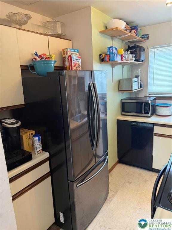 3353 Windermere Dr, Lehman Twp, PA 18324 - kitchen with stainless steel microwave, dishwasher, freestanding refrigerator, and light countertops