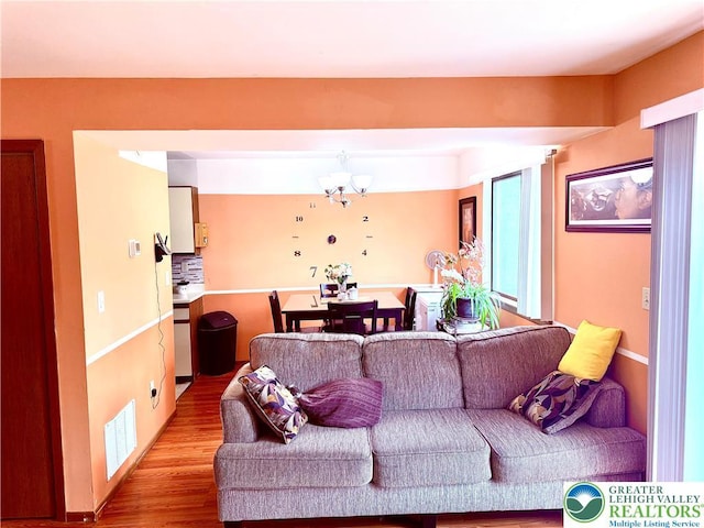 3353 Windermere Dr, Lehman Twp, PA 18324 - living room with a chandelier and wood finished floors