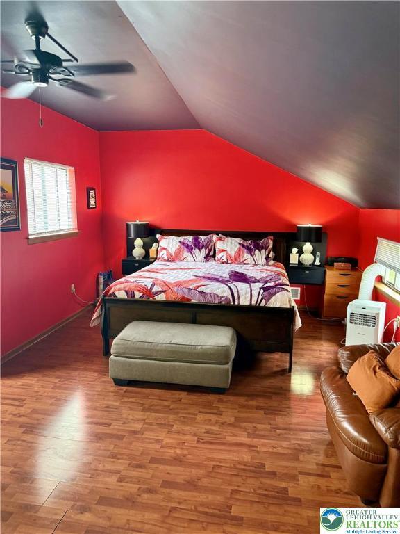 3353 Windermere Dr, Lehman Twp, PA 18324 - bedroom with wood finished floors, lofted ceiling, and ceiling fan