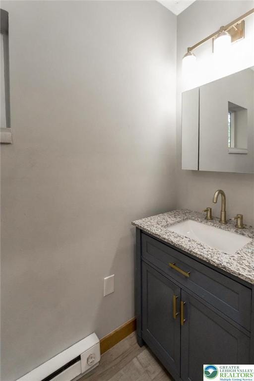 226 Fern St, Jim Thorpe Boro, PA 18229 - bathroom with a baseboard radiator, vanity, and wood finished floors