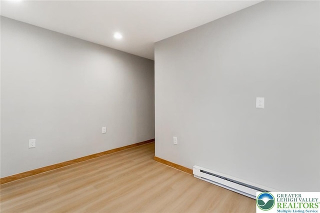 226 Fern St, Jim Thorpe Boro, PA 18229 - spare room featuring wood finished floors, a baseboard heating unit, and recessed lighting