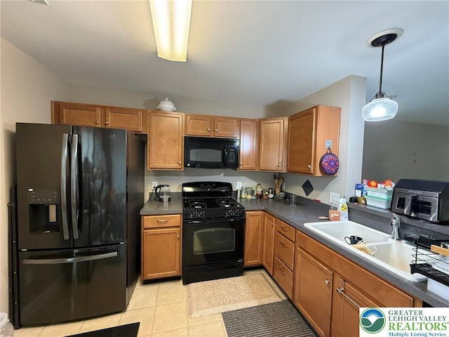 1499 Artisan Ct, Upper Macungie Twp, PA 18031 - kitchen featuring black appliances, decorative light fixtures, light tile patterned flooring, and dark countertops