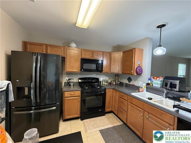 1499 Artisan Ct, Upper Macungie Twp, PA 18031 - kitchen featuring black appliances, decorative light fixtures, dark countertops, and brown cabinetry