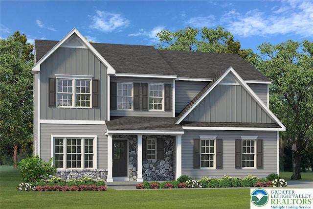 77 Tumble Creek Rd Unit 14, Williams Twp, PA 18042 - view of front of house featuring board and batten siding, a front yard, a porch, a shingled roof, and stone siding
