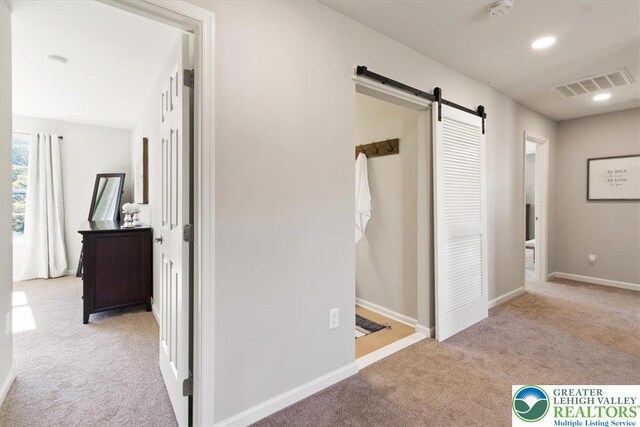 77 Tumble Creek Rd Unit 14, Williams Twp, PA 18042 - hallway featuring carpet, a barn door, and recessed lighting