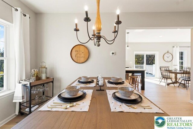 77 Tumble Creek Rd Unit 14, Williams Twp, PA 18042 - dining area with wood finished floors and a chandelier