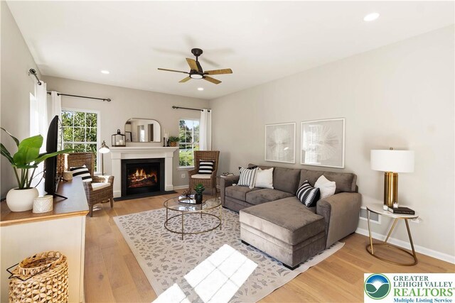 77 Tumble Creek Rd Unit 14, Williams Twp, PA 18042 - living room featuring ceiling fan, light wood-style flooring, a fireplace with flush hearth, and recessed lighting