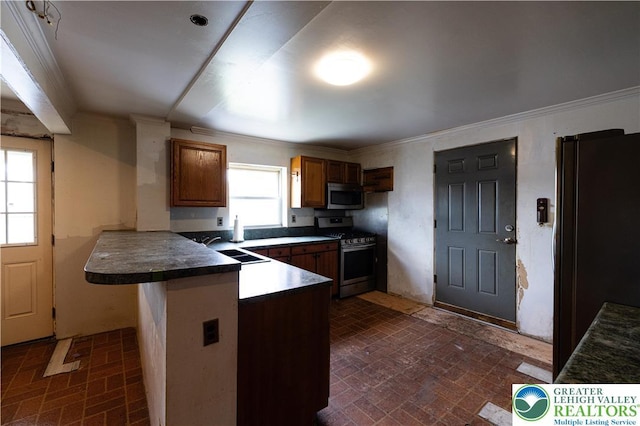 4220 Bethlehem Pike, Hilltown Twp, PA 18969 - kitchen with appliances with stainless steel finishes, brick patterned flooring, ornamental molding, dark countertops, and brown cabinetry