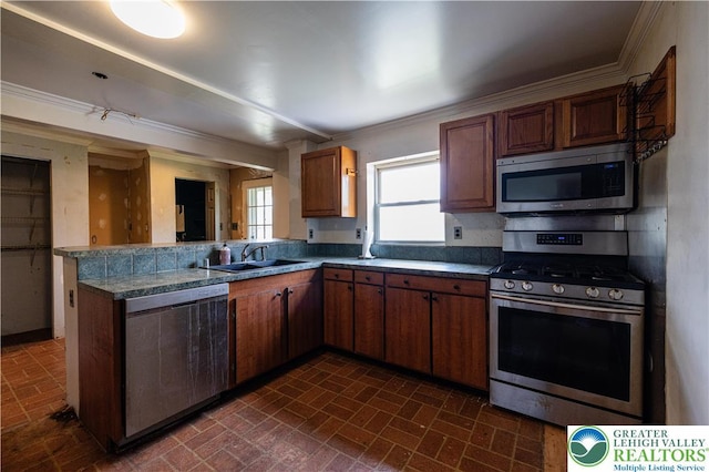 4220 Bethlehem Pike, Hilltown Twp, PA 18969 - kitchen featuring stainless steel appliances, brick patterned floors, crown molding, a peninsula, and dark countertops
