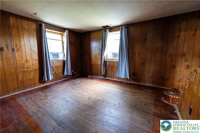 4220 Bethlehem Pike, Hilltown Twp, PA 18969 - empty room with hardwood / wood-style floors, cooling unit, and wood walls