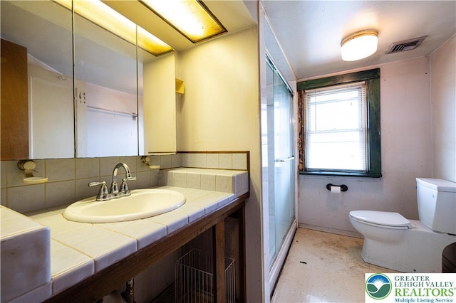 4220 Bethlehem Pike, Hilltown Twp, PA 18969 - bathroom featuring vanity, decorative backsplash, and a shower with shower door