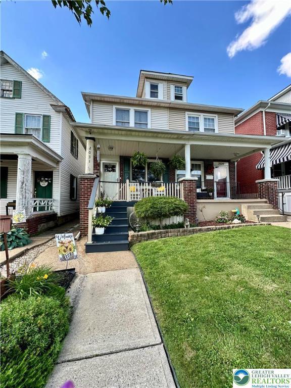 2031 Washington Blvd, Wilson Boro, PA 18042 - traditional style home with a porch, brick siding, and a front yard