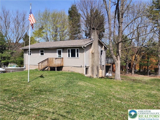 1007 Calypso, Wayne, PA 18436 - rear view of property with a chimney and a lawn